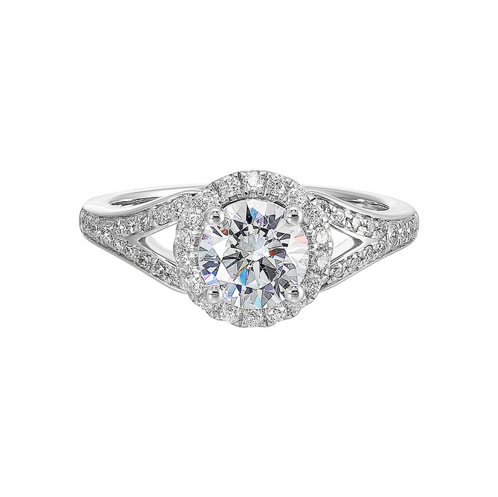 Halo engagement ring features an art deco inspired split shank design with diamond pave and glamourous round halo.