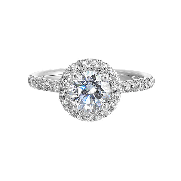 Sparkling center showcases a stunning halo followed by a delicate micro pave shank, perfect to add sparkles to your evening.