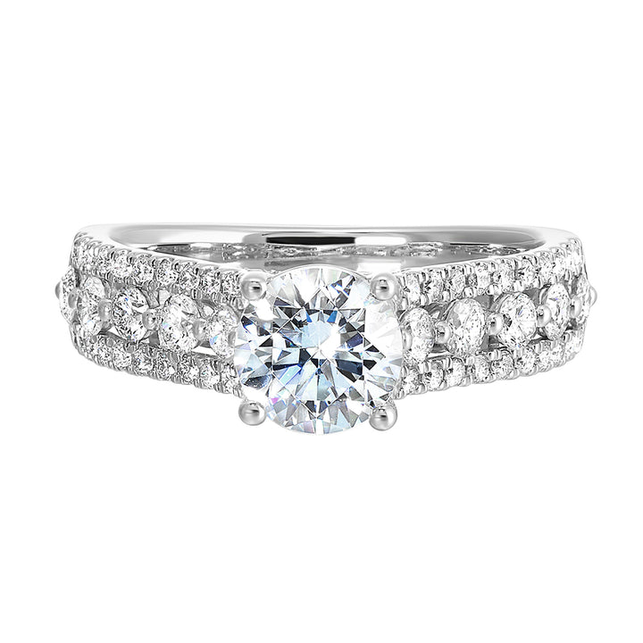 A triple row engagement ring with bigger diamond in center complemented by two micro row of diamonds on either side is perfect to sparkle your evening.
