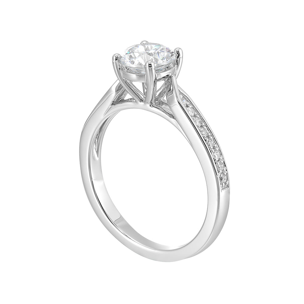An elegant tapered pave set shank is adorned with diamonds while an integrated solitare head sits on it perfectly.