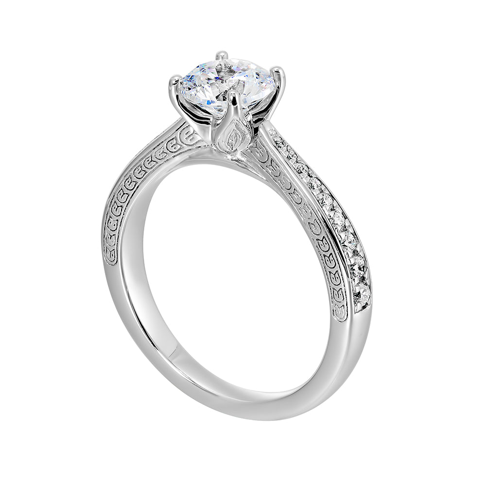 This classic solitare four prong diamond engagement ring features a reverse pave tapered shank accented with front details.