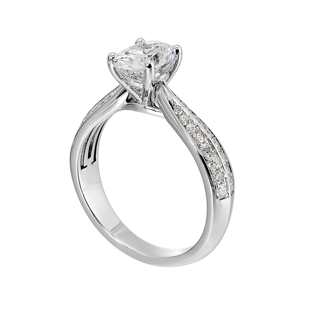 Pave set knife edge engagement ring with oval solitaire creates an elegant look with minimalist appeal.
