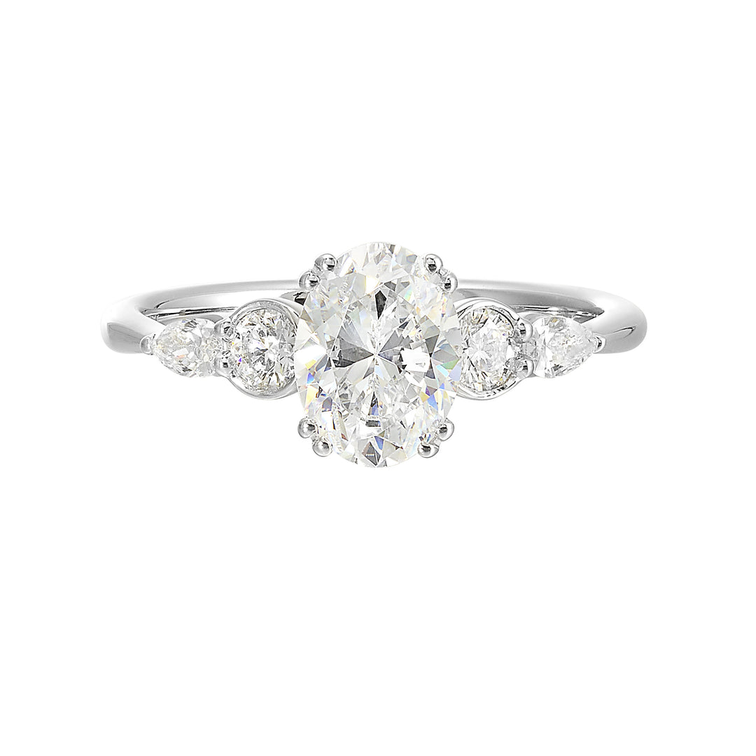 Classic five stone ring features round and pear diamonds that rest on either side of the round center diamond with a pinched shank for an elegant yet modern look.