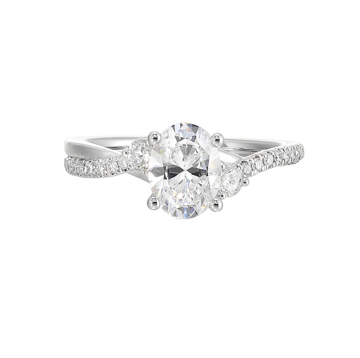 Glamorous three stone ring features curving bands with sparkling pave diamonds and metal forming a captivating details in front.