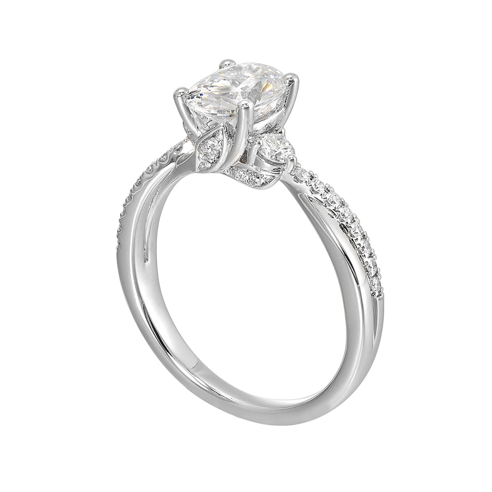 Glamorous three stone ring features curving bands with sparkling pave diamonds and metal forming a captivating details in front.