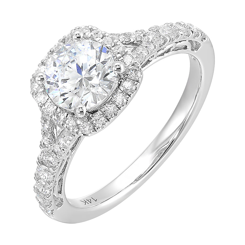 A softened cushion halo of diamonds surrounds the center solitare with front details. Pave split shank adds a stylish,  dazzling look.