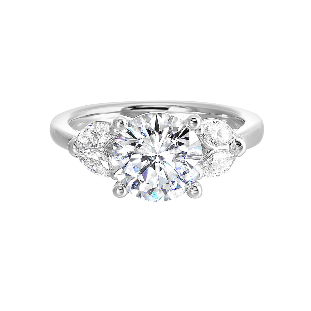 Contemporary style engagement ring features marquise set diamond on the band shoulder highlighting the center solitare.
