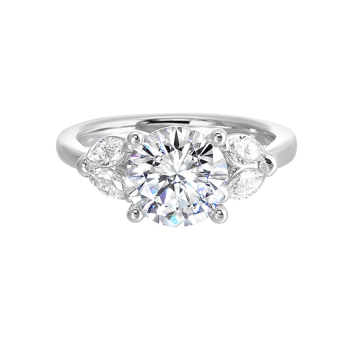 Contemporary style engagement ring features marquise set diamond on the band shoulder highlighting the center solitare.