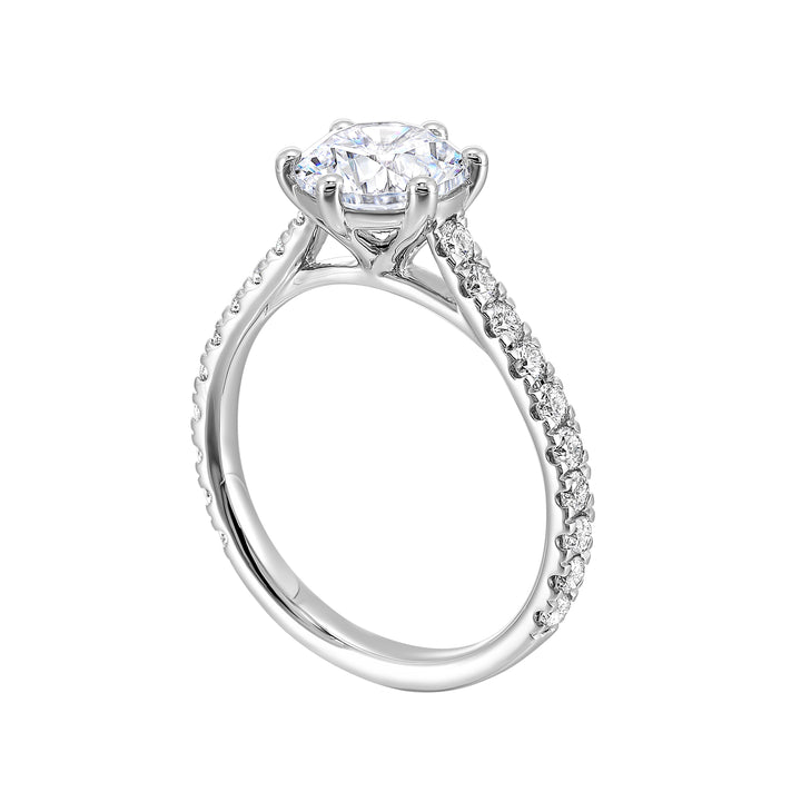 Dainty, timeless and elegant, this classic 6 prong solitare diamond engagement ring is a timeless design with petite pave band.