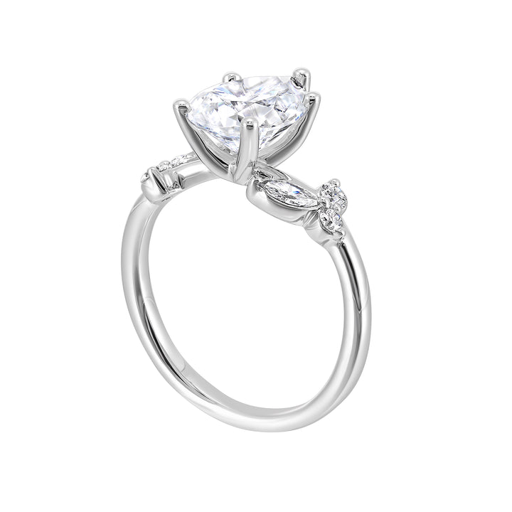 Timeless pear cut engagement ring features marquise and round diamonds placed randomly are perfect for her special day.
