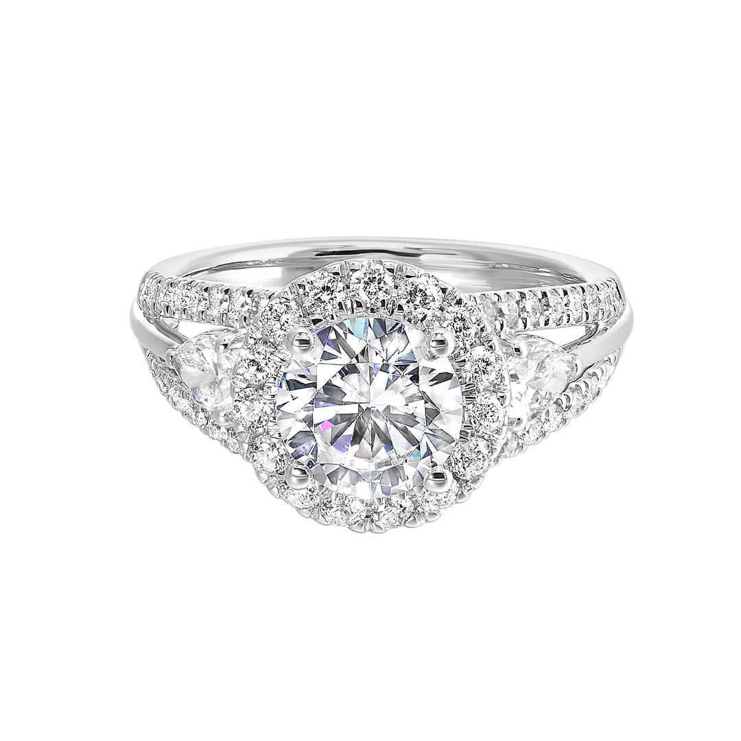 Start your love story with sparkles of this marquise and round diamond three stone engagement ring. The three rows shank have a beautiful split with pave studded diamonds on the sides.