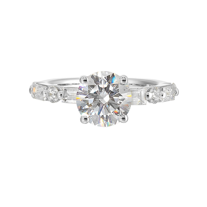 Baguettes and round diamonds spell contemporary elegance along this solitaire engagement ring.
