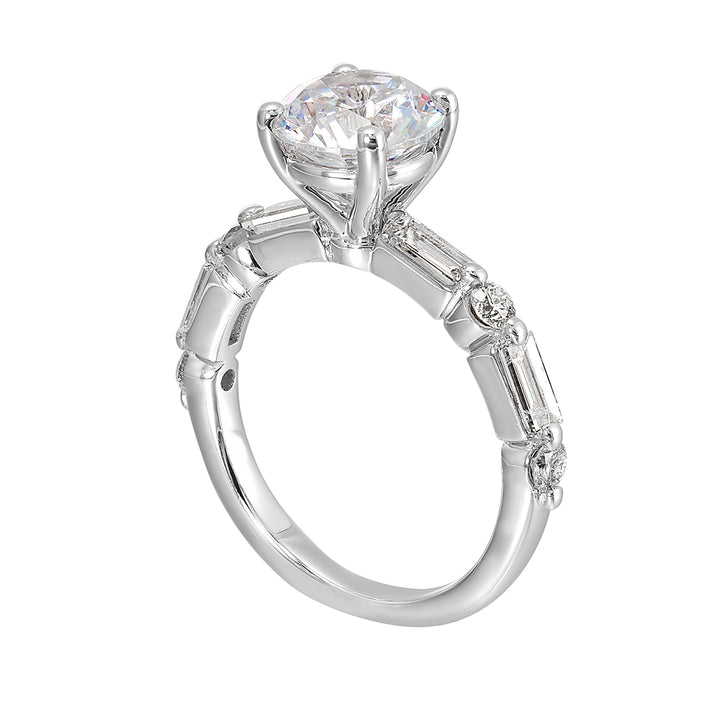 Baguettes and round diamonds spell contemporary elegance along this solitaire engagement ring.