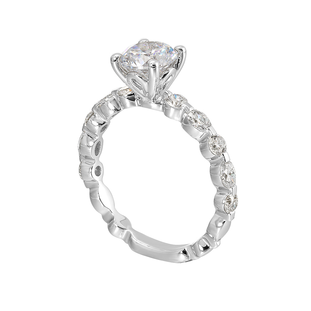 This trendy engagement ring features single prong diamonds set along the shank with stunning solitaire in center.