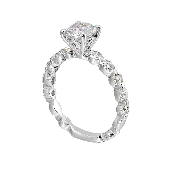 This trendy engagement ring features single prong diamonds set along the shank with stunning solitaire in center.