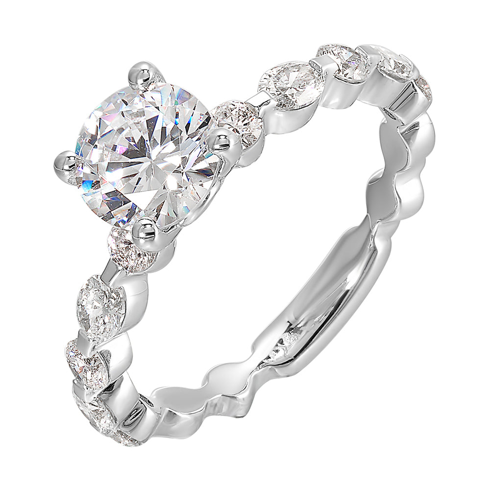 This trendy engagement ring features single prong diamonds set along the shank with stunning solitaire in center.