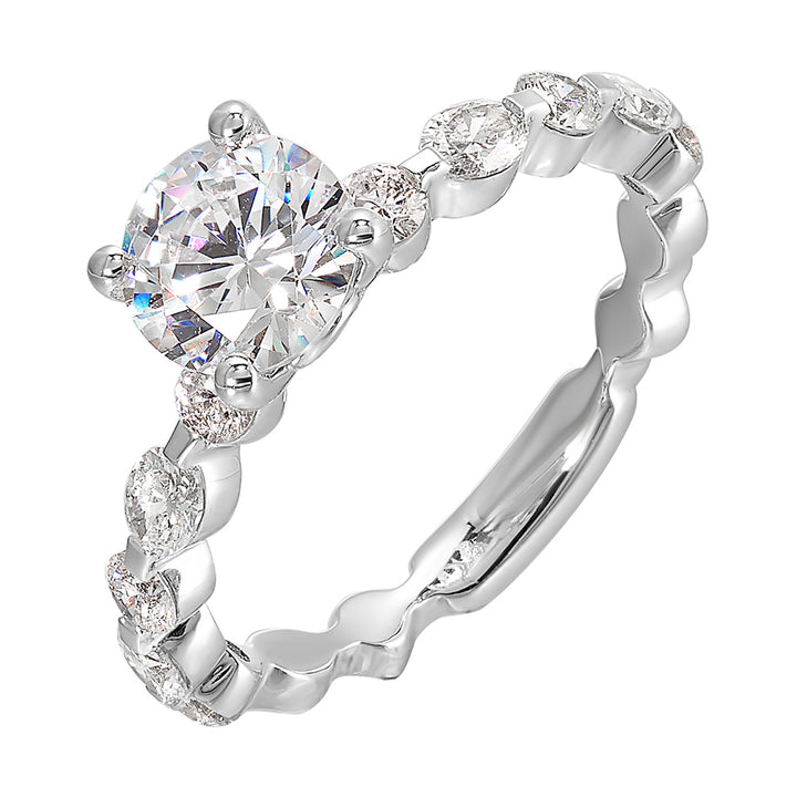 This trendy engagement ring features single prong diamonds set along the shank with stunning solitaire in center.