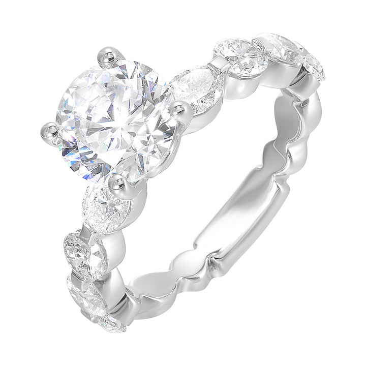 Gorgeous as you marqusie and round diamonds are set alternatively in the shank with round solitaire of this modern engagement ring.