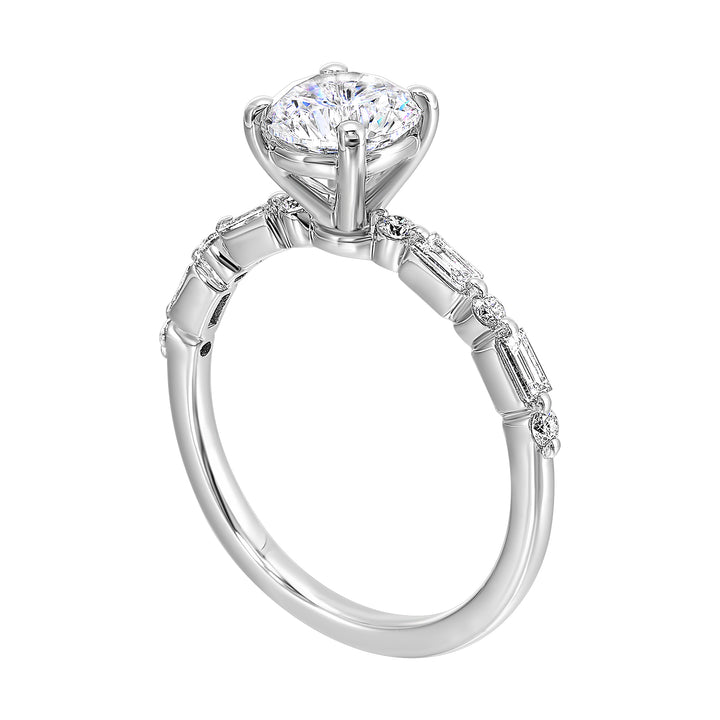 Fancy designed solitaire diamond ring with baugette and round shank details symbolizes everlasting love.