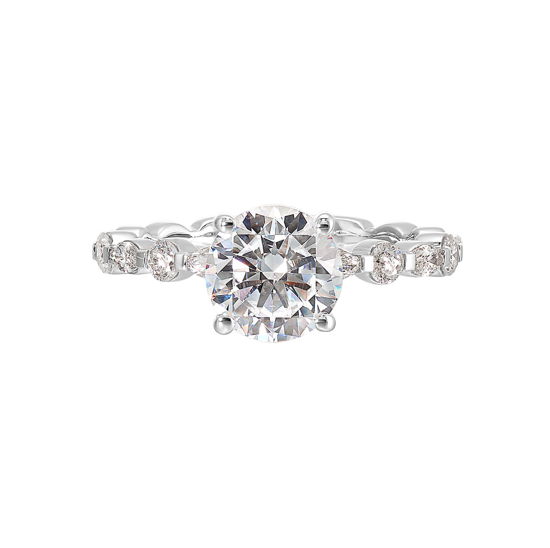 You are sure to cause a sensation with marqusie and round diamonds engagement ring highlighting the center solitaire.