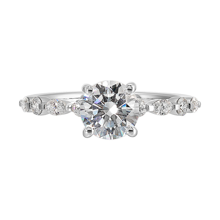 Treasure the special moment forever with marquise and round shape diamond in this sparkling round center engagement ring.