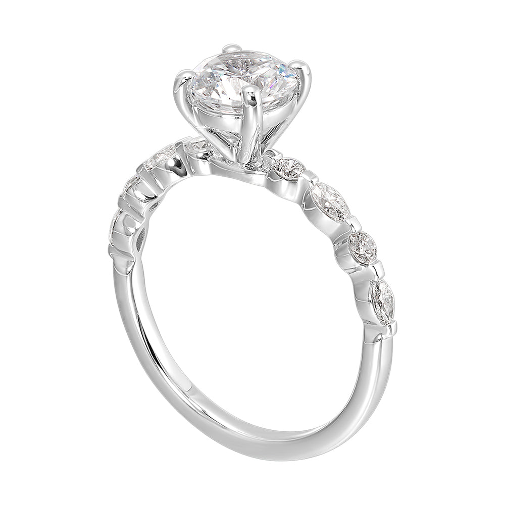 Treasure the special moment forever with marquise and round shape diamond in this sparkling round center engagement ring.