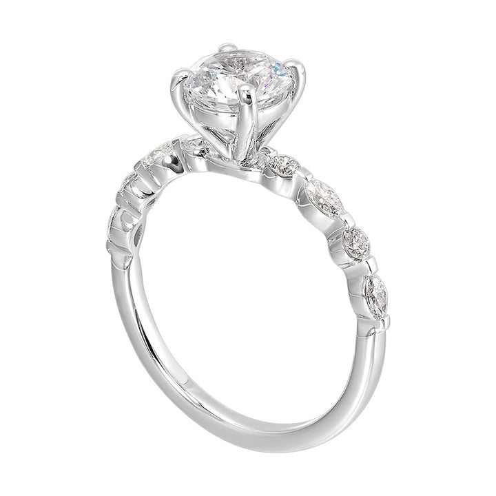 Treasure the special moment forever with marquise and round shape diamond in this sparkling round center engagement ring.