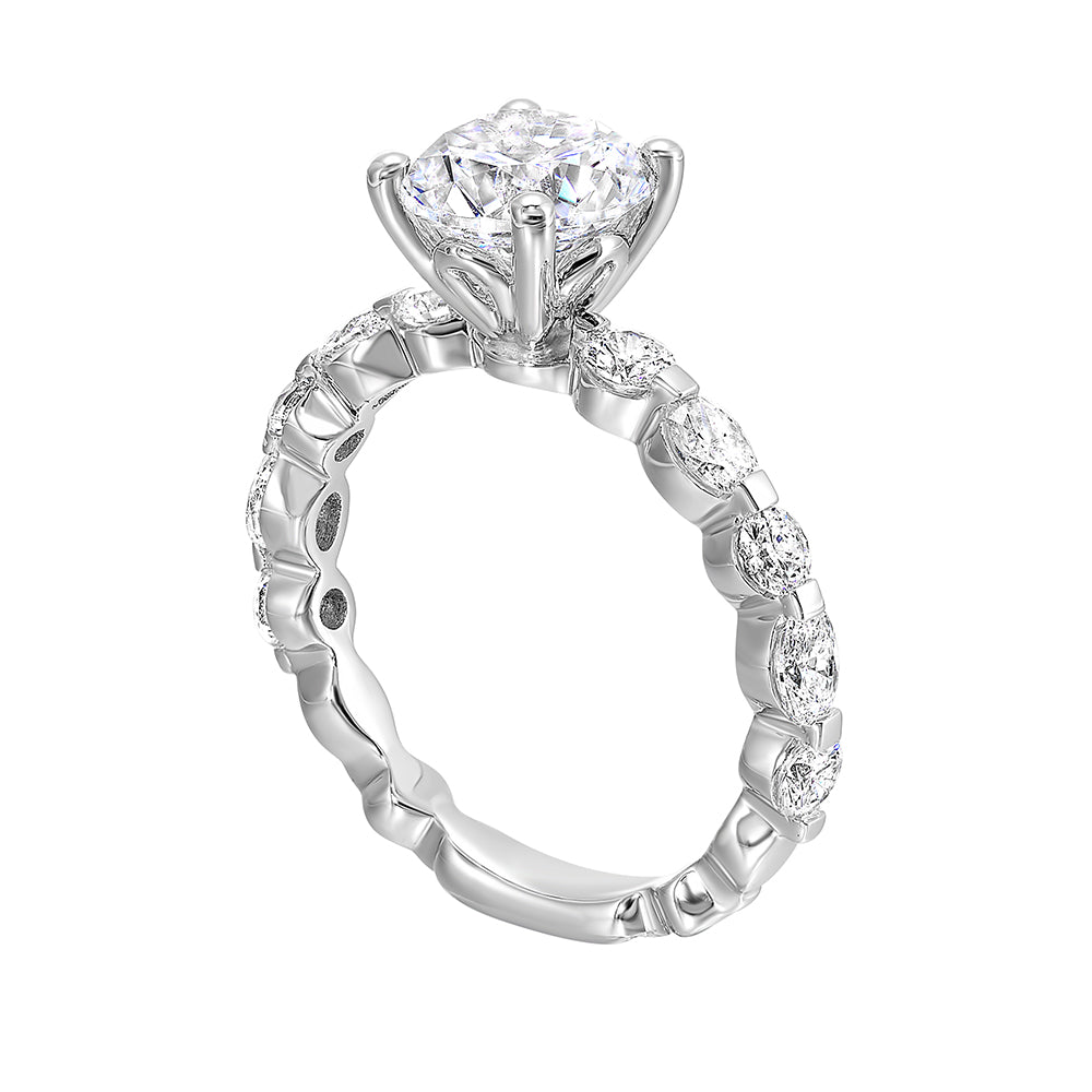 The Marquise and round diamond shank are a modern take on a classic look adding elegance and excitement to your look with bigger center diamond.