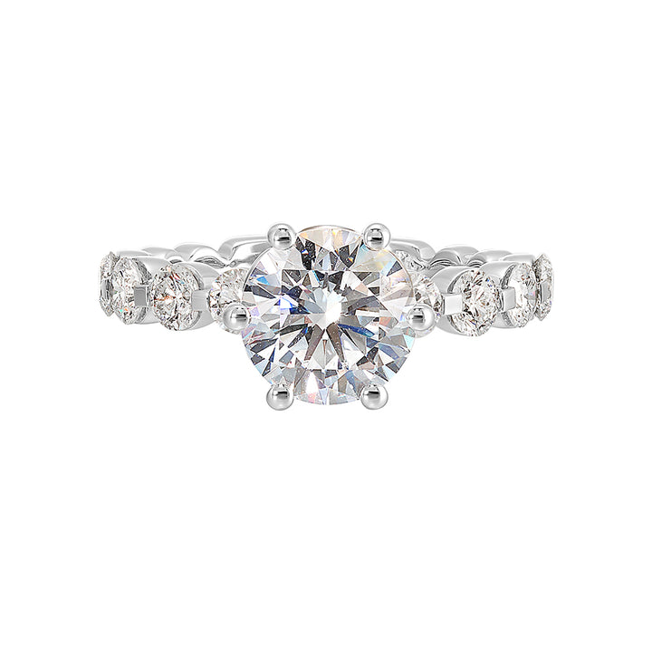 Timeless engagement ring with sparkling 6 prongs round center. Accent diamonds are set along the intricate shank with single prong look.