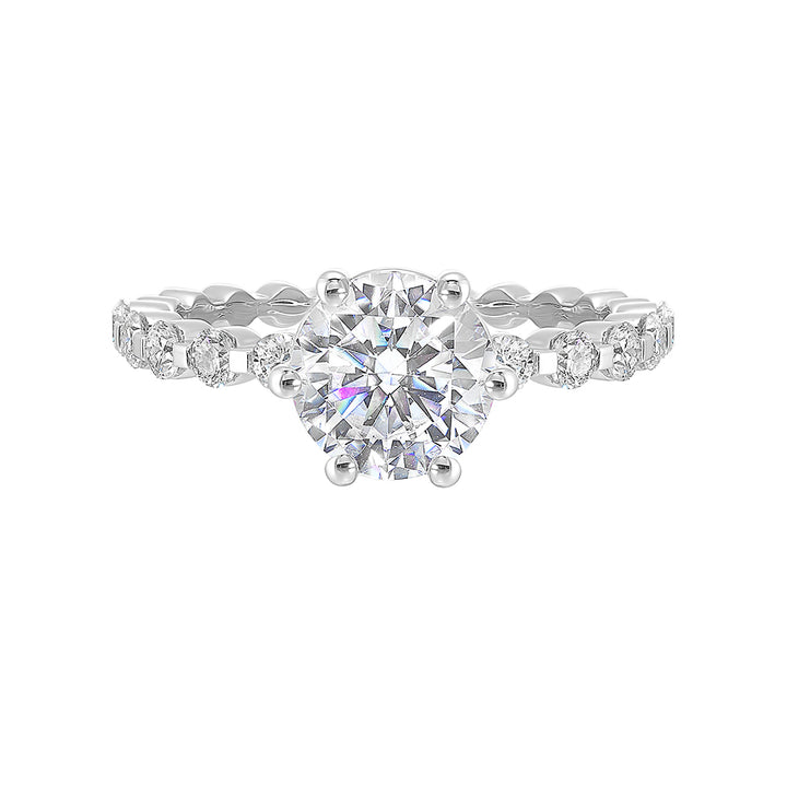 Clean and elegant with diamonds set in a single common prong along the shank shows off perfectly the center diamond set in 6 prong.