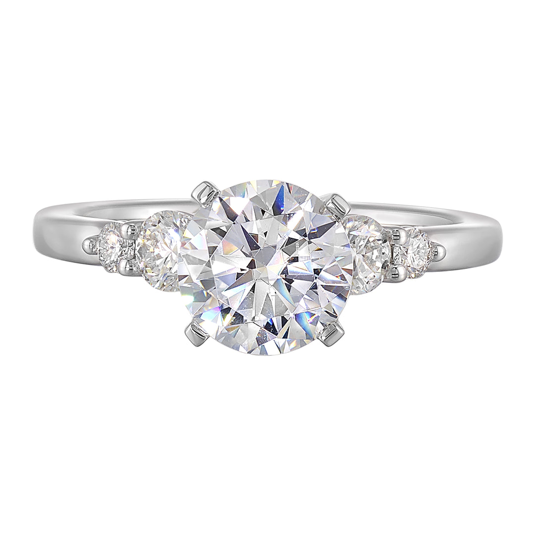 Five times diamonds for five times sparkles. A classic, lustrous band completes the look of this five stone engagement ring.