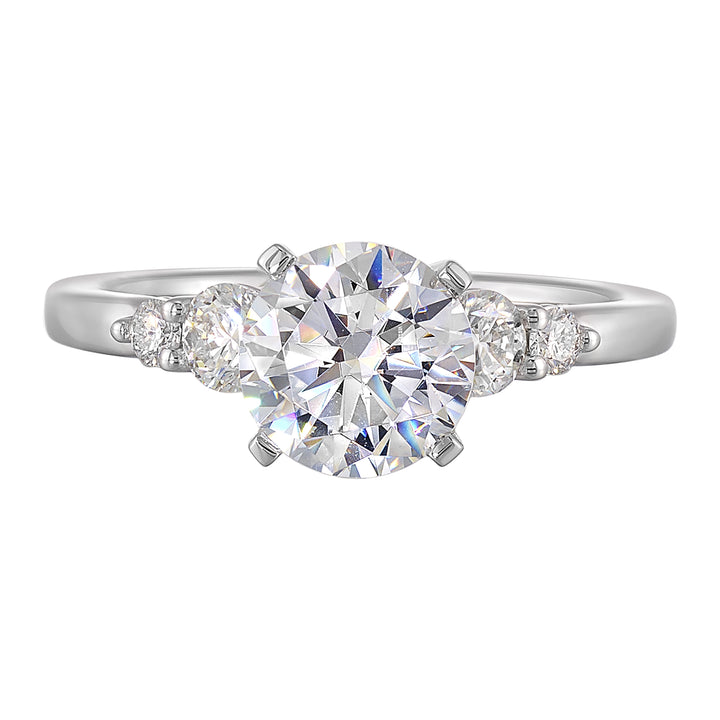 Five times diamonds for five times sparkles. A classic, lustrous band completes the look of this five stone engagement ring.
