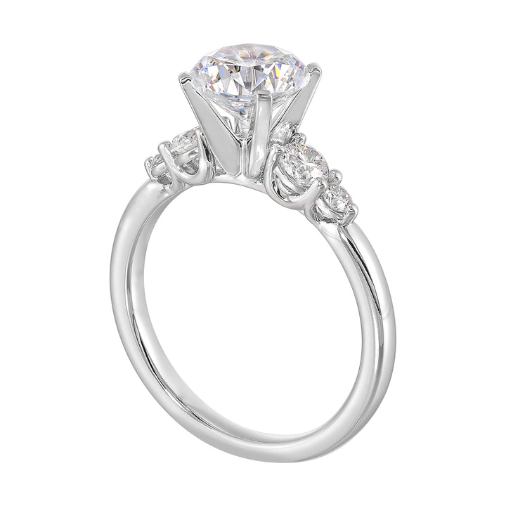 Five times diamonds for five times sparkles. A classic, lustrous band completes the look of this five stone engagement ring.