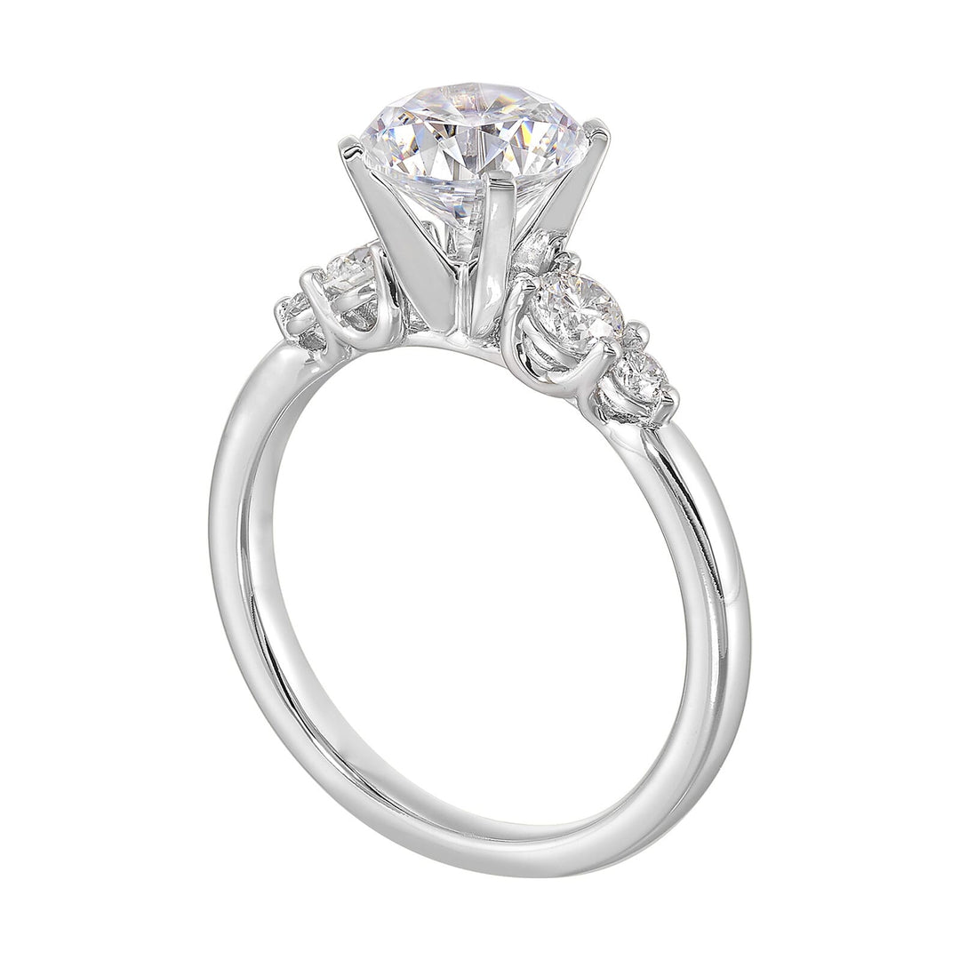 Five times diamonds for five times sparkles. A classic, lustrous band completes the look of this five stone engagement ring.