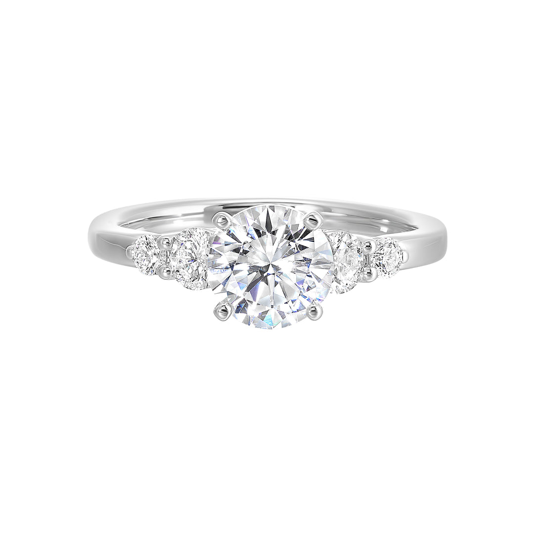 Five times diamonds for five times sparkles. A classic, lustrous band completes the look of this five stone engagement ring.