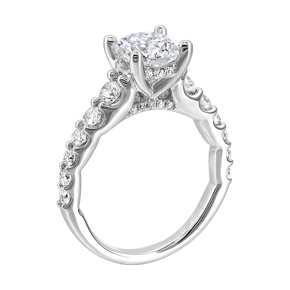 Dazzle with this gorgeous engagement ring featuring a round diamond center.  The shank is graduated with large round diamonds, set in shared prongs.