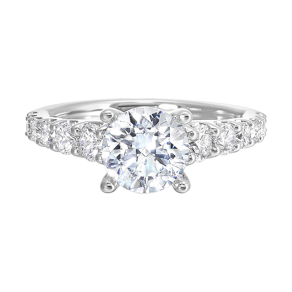 Dazzle with this gorgeous engagement ring featuring a round diamond center.  The shank is graduated with large round diamonds,  set in shared prongs.