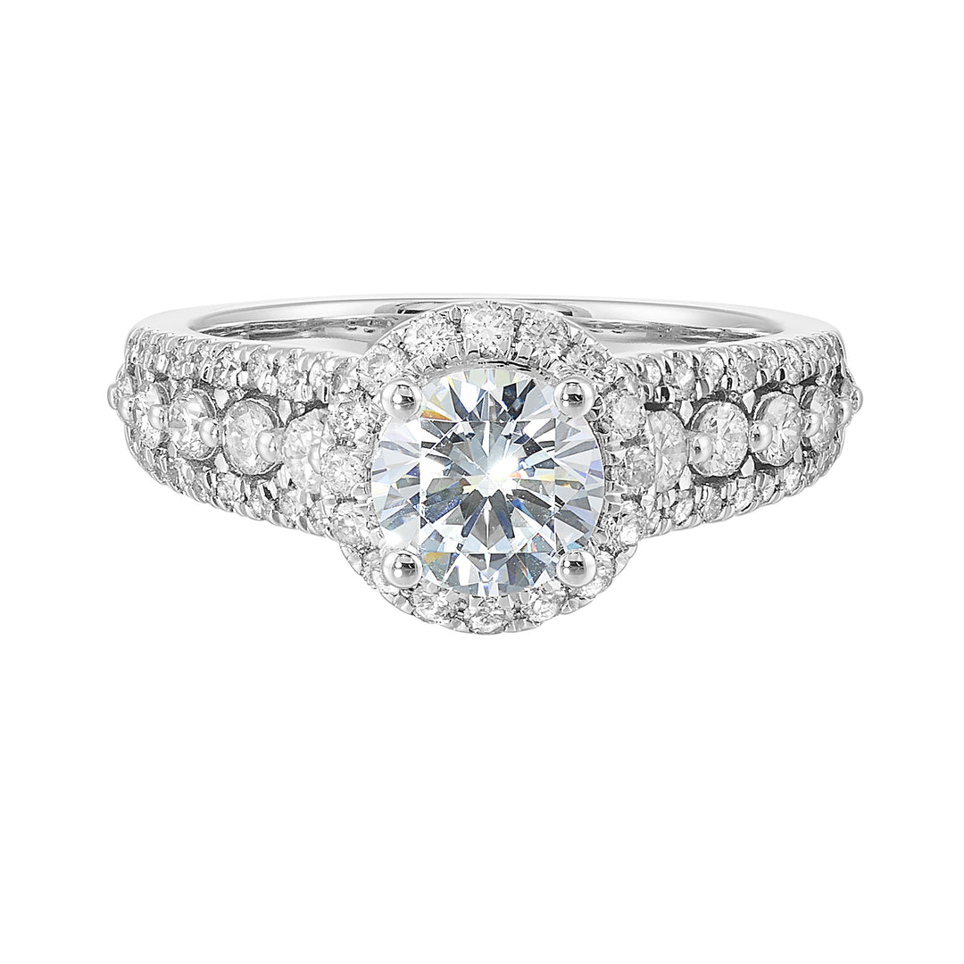 Halo shines with a stunning solitaire, embraced by luxurious three row shank tappering towards the bottom consisting of bigger diamonds in the center row is sure of a stunner.
