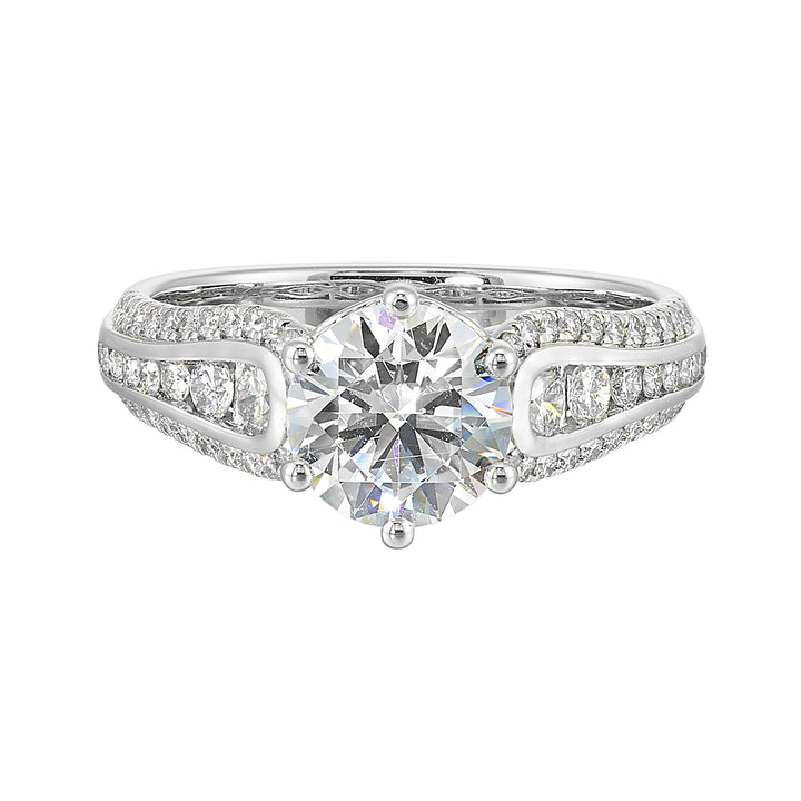 Stunning solitaire ring set in 6 prongs is a dazzling display of channel set diamonds in the center & pave on sides making the ring more appealing.